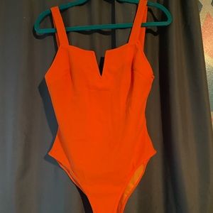 orange bodysuit